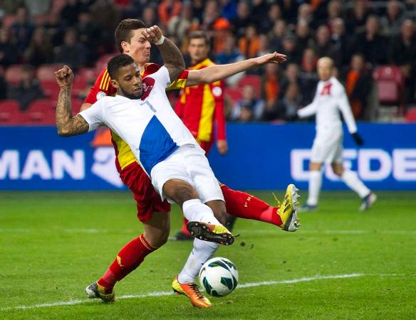 Lens of the Netherlands scores a goal past Gardos of Romania during their World Cup qualifying soccer match in Amsterdam