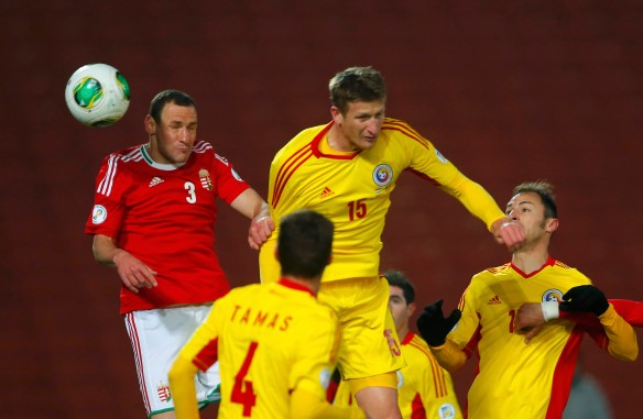 Vanczak of Hungary scores in front of Tamas, Goian and Radu of Romania during their 2014 World Cup Group D qualifying soccer match in Budapest
